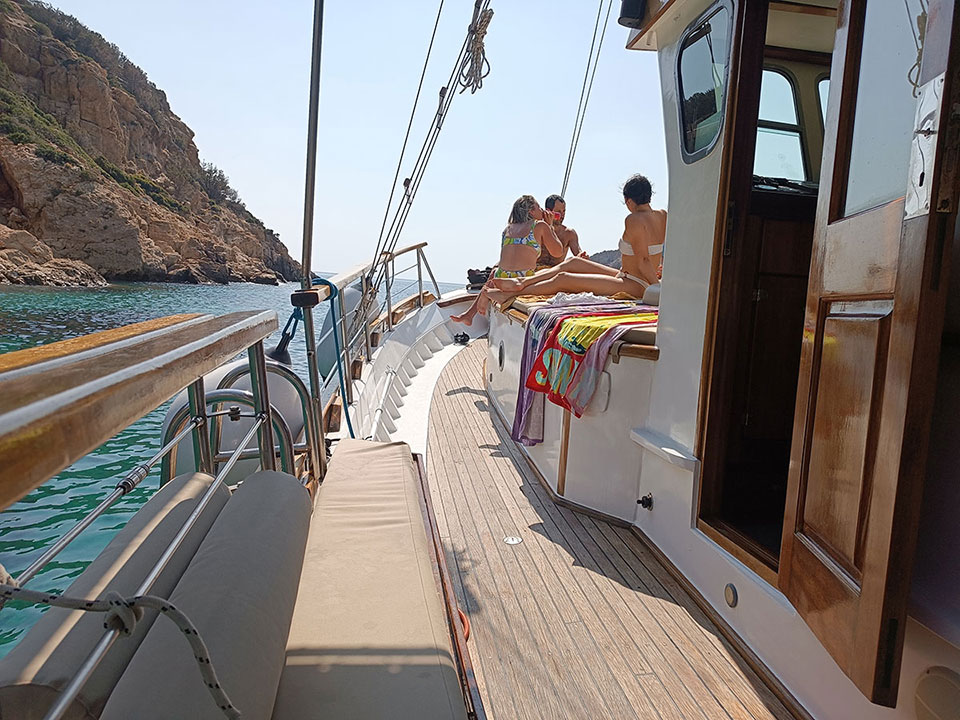Enjoying the sun on Aegeas wooden deck
